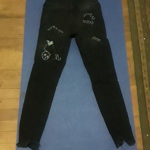 black jeans with white writing